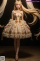 A woman with long blonde hair wearing a dress.