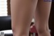 A close up of a woman's legs on a table.