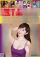 a japanese woman in a purple tank top is posing for the camera